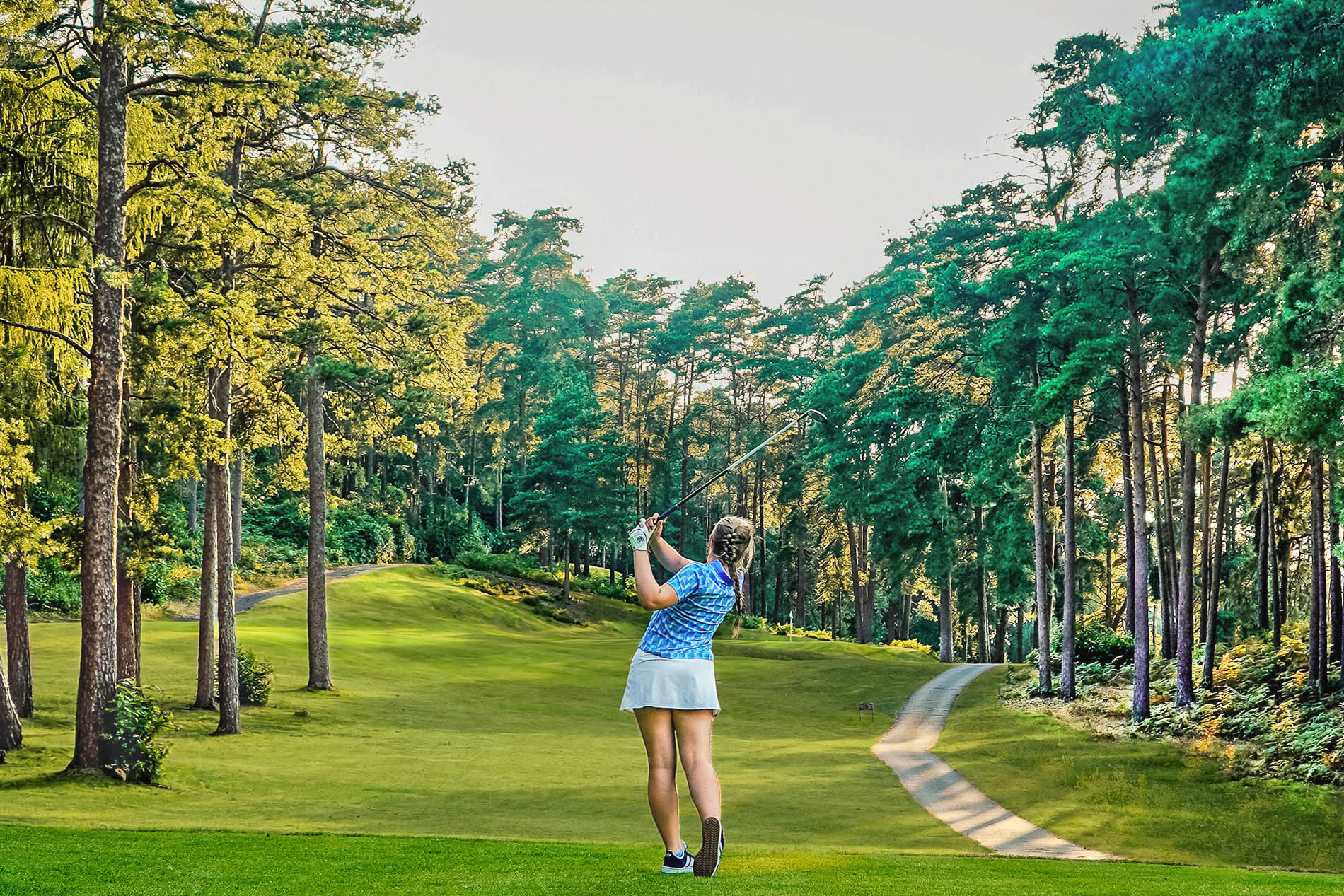 Lady at Old Thorns playing golf